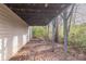 Exterior shot of the house, showing the structural supports for the backyard deck above at 994 Chapman Cir, Stone Mountain, GA 30088