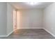 Unfinished basement with gray wood-look flooring and neutral paint, ready for customization at 994 Chapman Cir, Stone Mountain, GA 30088