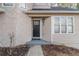 Inviting front entrance featuring a black door with a stone and siding facade at 994 Chapman Cir, Stone Mountain, GA 30088