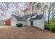 Traditional-style home with neutral siding, a two-car garage, and mature trees at 994 Chapman Cir, Stone Mountain, GA 30088