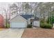 Charming single-Gathering home with a two-car garage and a well-maintained lawn at 994 Chapman Cir, Stone Mountain, GA 30088