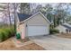 Spacious two-car garage with a new white door and ample driveway space at 994 Chapman Cir, Stone Mountain, GA 30088