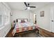 Bedroom featuring hardwood floors, ceiling fan and natural light from the window at 1090 Indale Sw Pl, Atlanta, GA 30310