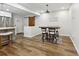 Open dining area features wood floors, a modern light fixture and seating for four at 1090 Indale Sw Pl, Atlanta, GA 30310