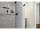 Modern shower featuring gray subway tile, built-in niche, and black hardware at 1090 Indale Sw Pl, Atlanta, GA 30310