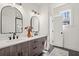 Modern bathroom with double vanity and elegant lighting fixtures at 1183 Mobile Nw St, Atlanta, GA 30314