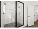 Bright bathroom features a glass enclosed shower and tile flooring at 1183 Mobile Nw St, Atlanta, GA 30314