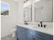 Modern bathroom with double vanity, quartz countertop, and matte black fixtures at 1183 Mobile Nw St, Atlanta, GA 30314