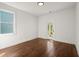 Bright bedroom with hardwood floors, a large window, and a door to the outside deck at 1183 Mobile Nw St, Atlanta, GA 30314