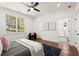 Well-lit bedroom features a ceiling fan and a navy rug at 1183 Mobile Nw St, Atlanta, GA 30314