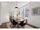 Elegant dining room with a modern light fixture and a view of the kitchen at 1183 Mobile Nw St, Atlanta, GA 30314