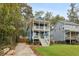 Charming two-story home with a welcoming front porch and lush green lawn at 1183 Mobile Nw St, Atlanta, GA 30314