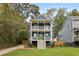 Charming two-story home with a covered porch and lush green lawn at 1183 Mobile Nw St, Atlanta, GA 30314