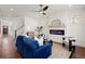 Inviting living room with a modern fireplace, plush blue sofa, and lots of natural light at 1183 Mobile Nw St, Atlanta, GA 30314