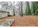 Expansive backyard featuring a shed, patio and chain-link fence, perfect for outdoor activities at 1850 Brewer Sw Blvd, Atlanta, GA 30310