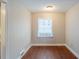 Neutral dining room with wood floors and one large window at 1850 Brewer Sw Blvd, Atlanta, GA 30310