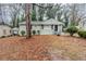 Charming one-story home with manicured lawn and mature trees providing shade and curb appeal at 1850 Brewer Sw Blvd, Atlanta, GA 30310