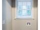 A window in a laundry area provides natural light over the hookups at 1850 Brewer Sw Blvd, Atlanta, GA 30310