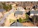 Aerial view of the back of the house and the neighborhood, highlighting its location and landscaping at 3135 Preservation Cir, Lilburn, GA 30047