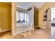 Bright bathroom featuring a soaking tub, glass shower, and tile floors at 3135 Preservation Cir, Lilburn, GA 30047