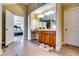 Bright bathroom featuring double vanities, tile floors, and an open doorway to the main bedroom at 3135 Preservation Cir, Lilburn, GA 30047