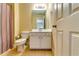 Bright bathroom featuring a vanity with storage, toilet and shower with curtain at 3135 Preservation Cir, Lilburn, GA 30047