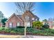 Inviting brick home with manicured greenery and a well-maintained lawn at 3135 Preservation Cir, Lilburn, GA 30047