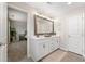 Bathroom featuring double vanity, large mirror, and neutral décor at 3610 Silvery Way, Powder Springs, GA 30127