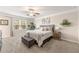 Bright bedroom featuring a ceiling fan, neutral color scheme, and comfortable furnishings at 3610 Silvery Way, Powder Springs, GA 30127