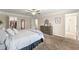 Bedroom featuring an ensuite bathroom, walk in closet, and neutral decor at 3610 Silvery Way, Powder Springs, GA 30127