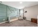 Modern Bedroom with a patterned accent wall and ample natural light at 3610 Silvery Way, Powder Springs, GA 30127