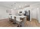 Bright kitchen with stainless steel appliances, quartz countertops, and a breakfast bar island at 3610 Silvery Way, Powder Springs, GA 30127