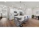 Spacious kitchen island featuring barstool seating, pendant lights, and stainless steel appliances at 3610 Silvery Way, Powder Springs, GA 30127