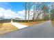 Paved walking path featuring a wooden fence with the community in the background at 3610 Silvery Way, Powder Springs, GA 30127