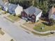 Aerial view of home boasting a two-car garage, well-maintained lawn, and established landscaping at 6474 E Meyer Dr, Morrow, GA 30260