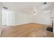 Minimalist living room with hardwood floors, a fireplace, and neutral paint at 6474 E Meyer Dr, Morrow, GA 30260