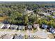 Aerial shot showcasing a lush, established neighborhood with tree-lined streets and well-kept homes at 6474 E Meyer Dr, Morrow, GA 30260