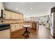 Spacious kitchen featuring stainless steel appliances, granite counters, tiled backsplash, and hardwood floors at 1034 Fairview Club Cir, Dacula, GA 30019