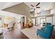 Bright living room with hardwood floors, a fireplace, and an adjacent dining area at 1034 Fairview Club Cir, Dacula, GA 30019