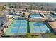 Aerial view of the neighborhood tennis courts and clubhouse with pool and parking at 1034 Fairview Club Cir, Dacula, GA 30019