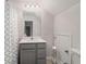 Bathroom featuring a gray vanity with a white countertop, a toilet, and a shower with a patterned curtain at 3320 Reagan Way # 80, Lawrenceville, GA 30044