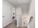 Upstairs hallway showcasing neutral walls, carpeted floors, and a view of the bedroom through an open door at 3320 Reagan Way # 80, Lawrenceville, GA 30044