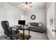 Bright office space with modern desk, comfortable sofa, and natural light at 3320 Reagan Way # 80, Lawrenceville, GA 30044