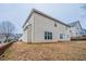 Back exterior view of a two-story home with a fenced yard at 982 Ashton Park Dr, Lawrenceville, GA 30045