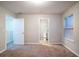 Neutral bedroom featuring a window and carpeted floors at 982 Ashton Park Dr, Lawrenceville, GA 30045