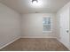 Neutral bedroom featuring a window and carpeted floors at 982 Ashton Park Dr, Lawrenceville, GA 30045