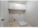 Small laundry room featuring white cabinets at 982 Ashton Park Dr, Lawrenceville, GA 30045