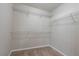 Spacious walk-in closet with built-in white wire shelving at 982 Ashton Park Dr, Lawrenceville, GA 30045