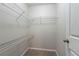 Spacious walk-in closet with built-in white wire shelving at 982 Ashton Park Dr, Lawrenceville, GA 30045