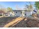 Expansive backyard features a patio, offering ample space for outdoor activities and gatherings at 2080 Dellwood Pl, Decatur, GA 30032